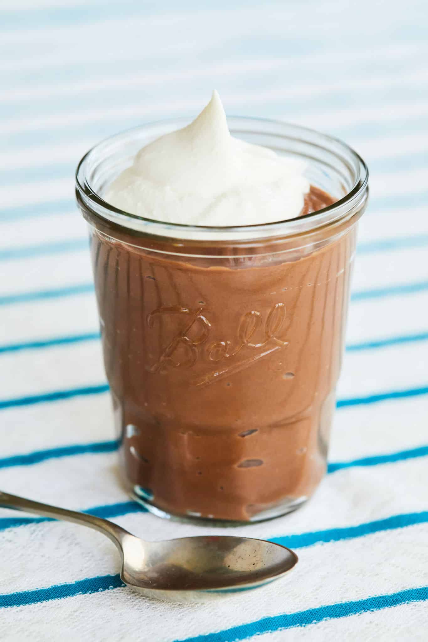 A single jar of creamy chocolate pudding.
