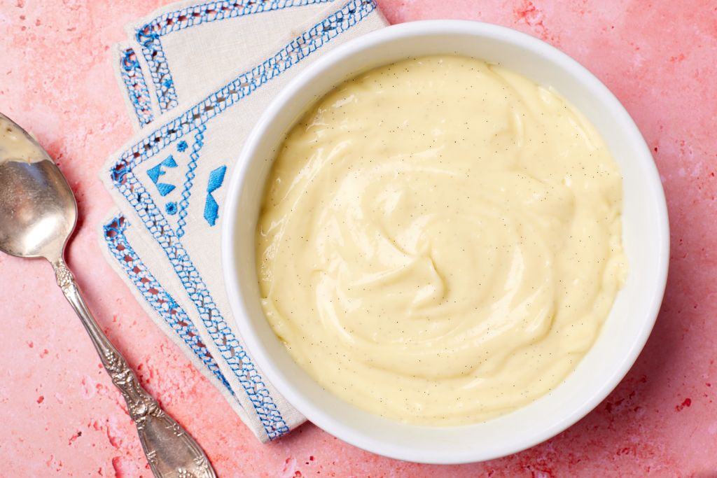 Top-down view of a bowl of silky smooth creme patisserie (pastry cream)