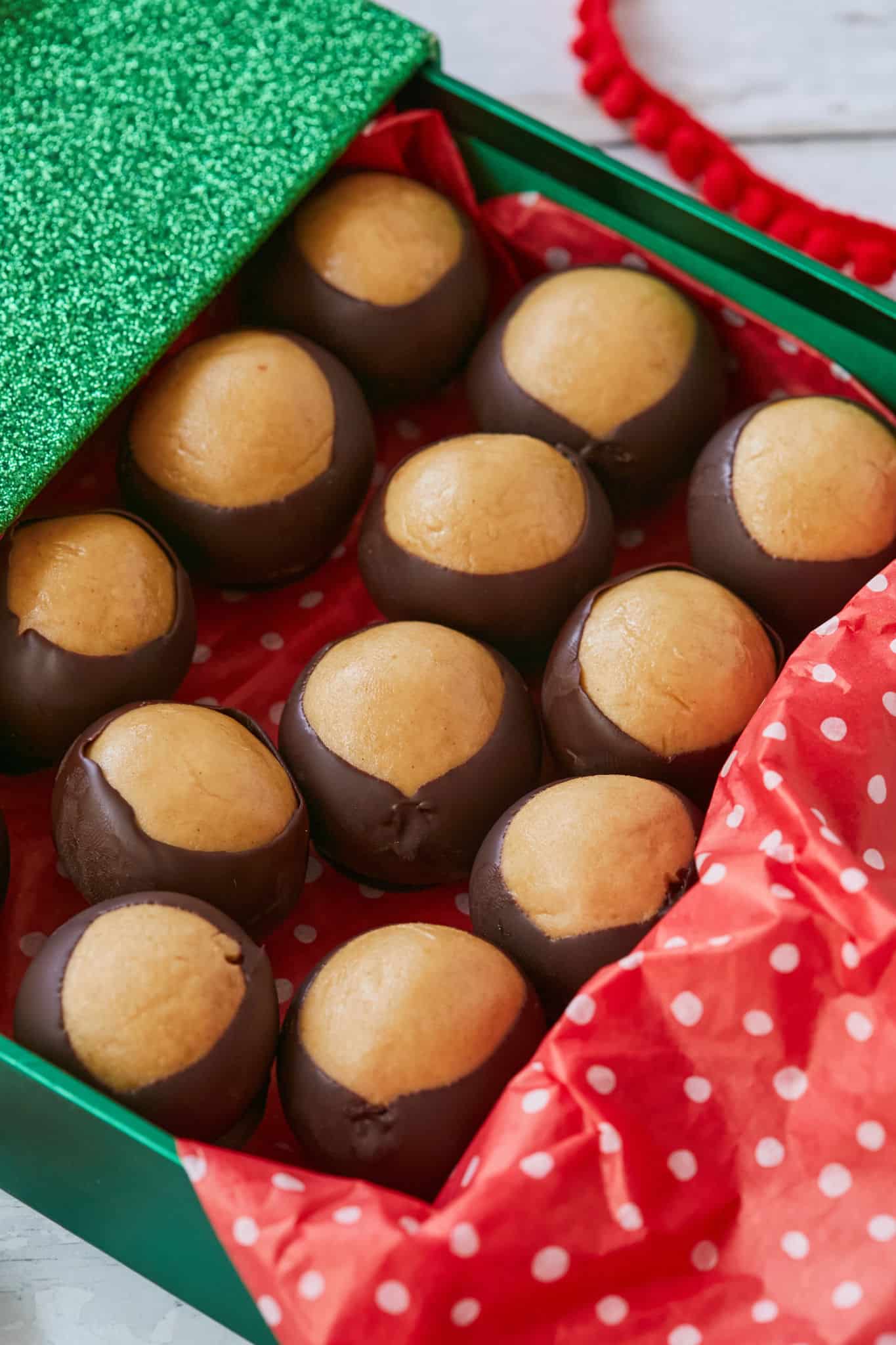 A close up of buckeyes to show the peanut butter and chocolate.