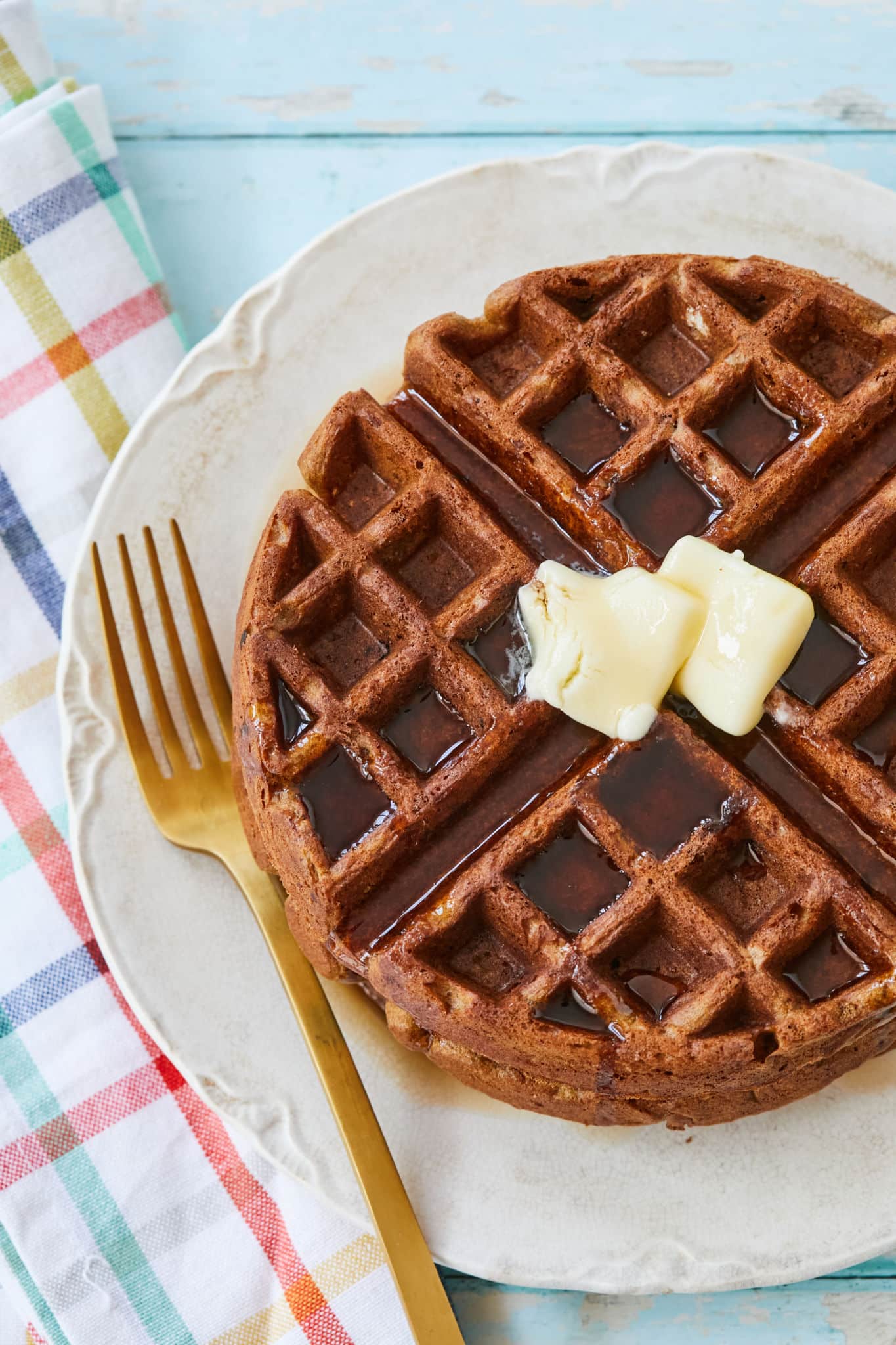 A plate with gingerbread waffles on it, to show texture.