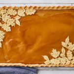 A pumpkin slab pie recipe with leaves as decorations.