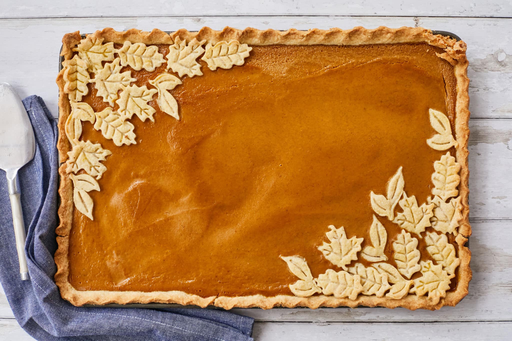 A pumpkin slab pie recipe with leaves as decorations.