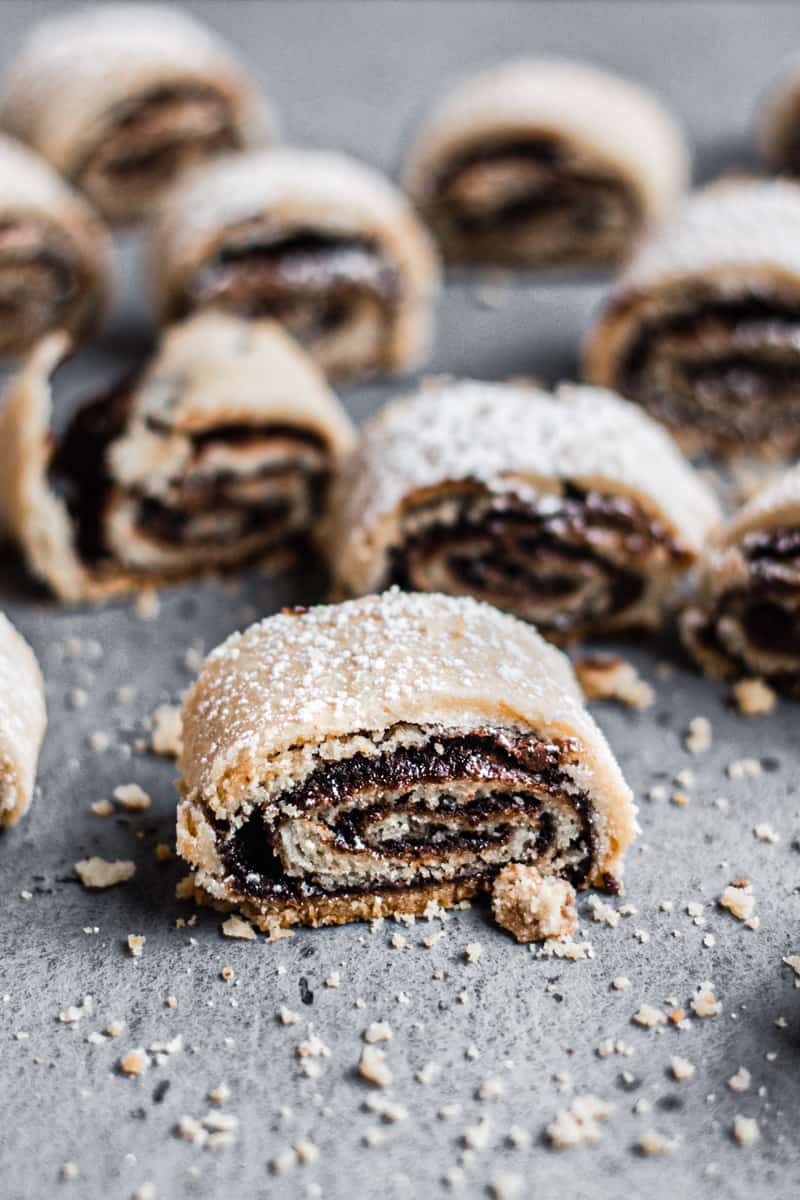 Chocolate rolled rugelach dusted with powdered sugar.
