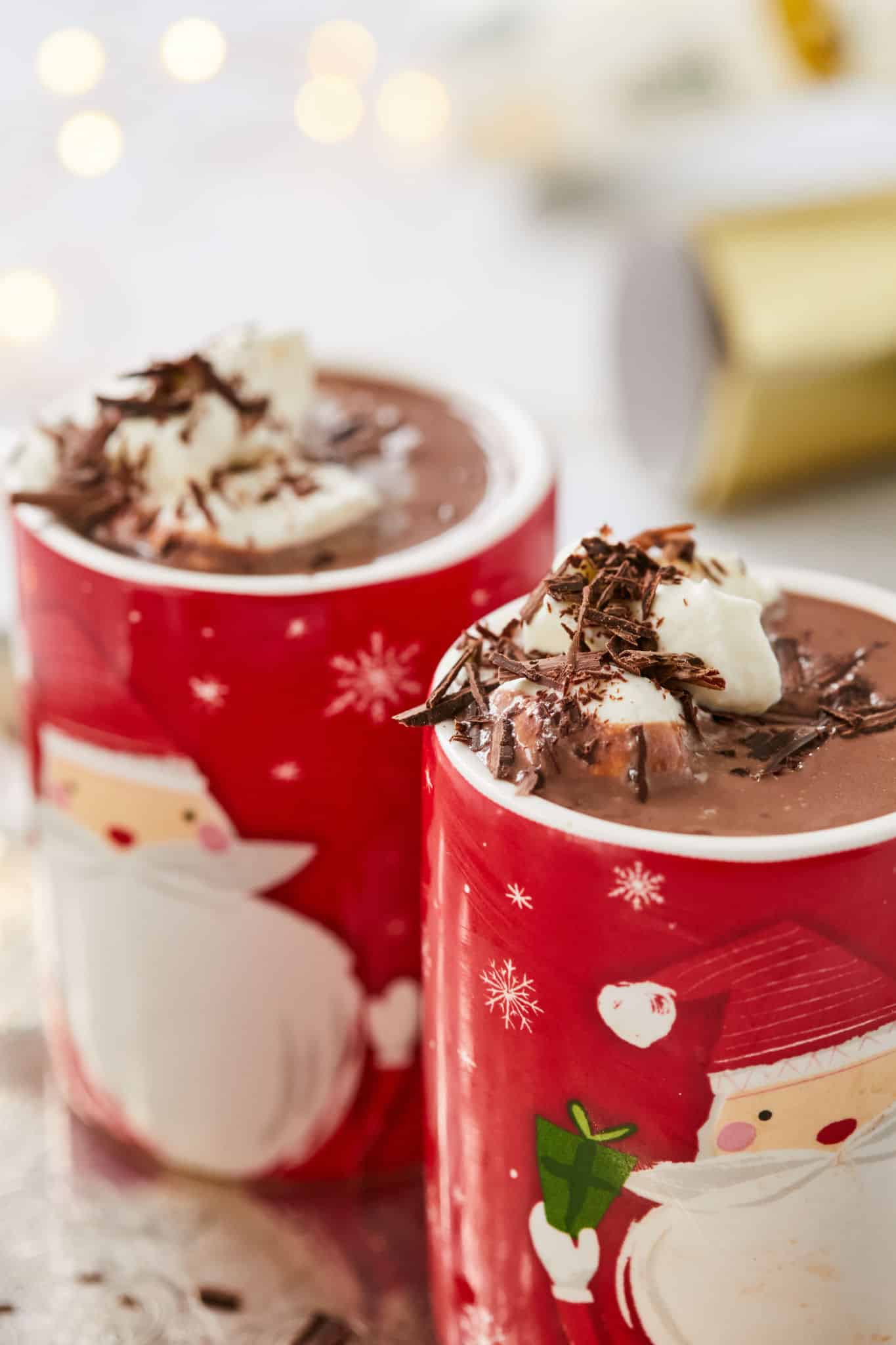 A close up of two mugs of bailey's hot chocolate.