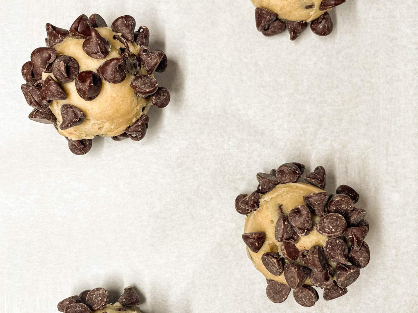 Cookie dough balls rolled in chocolate chips.