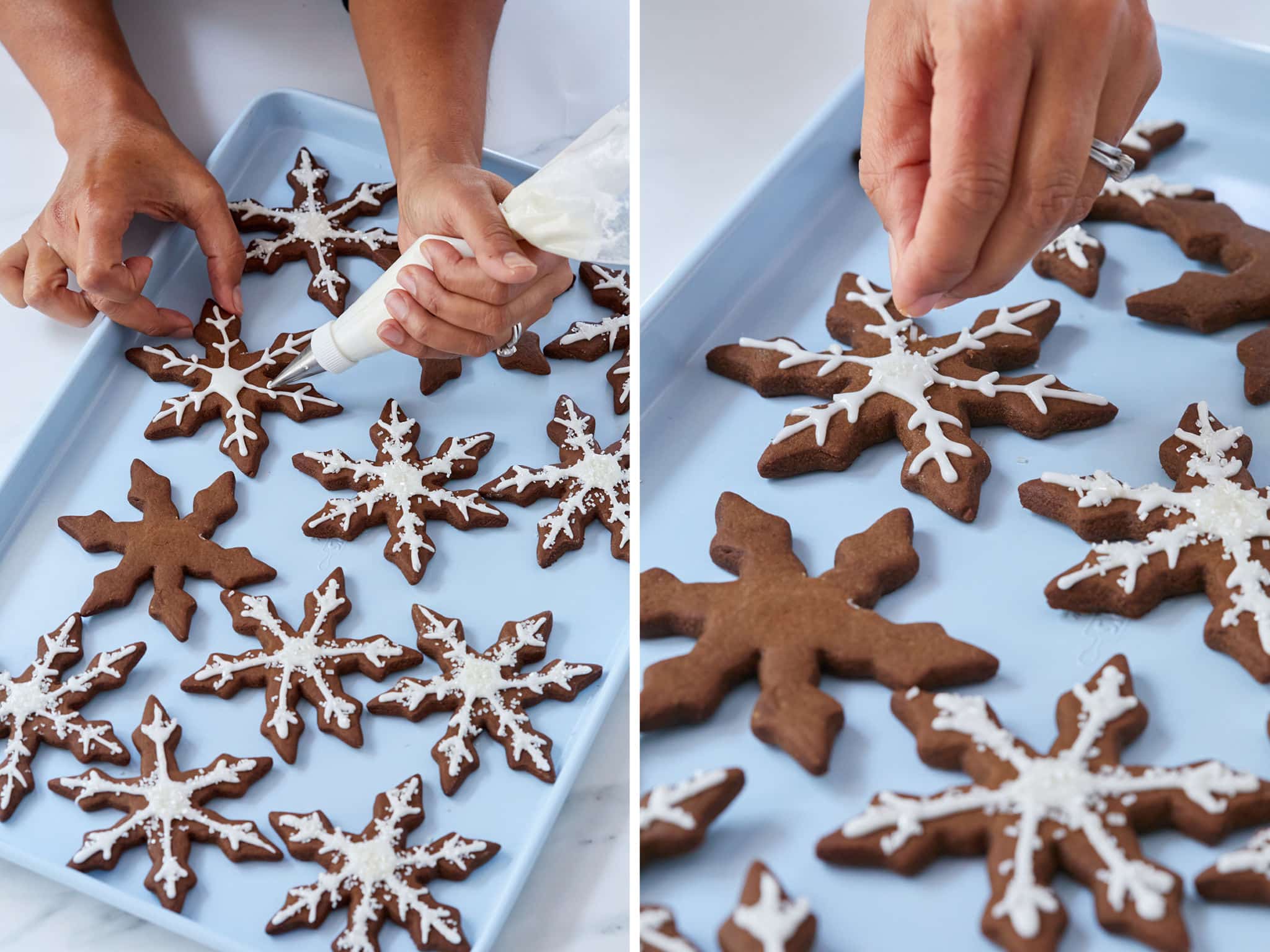 Hands putting sprinkles on snowflake cookies.