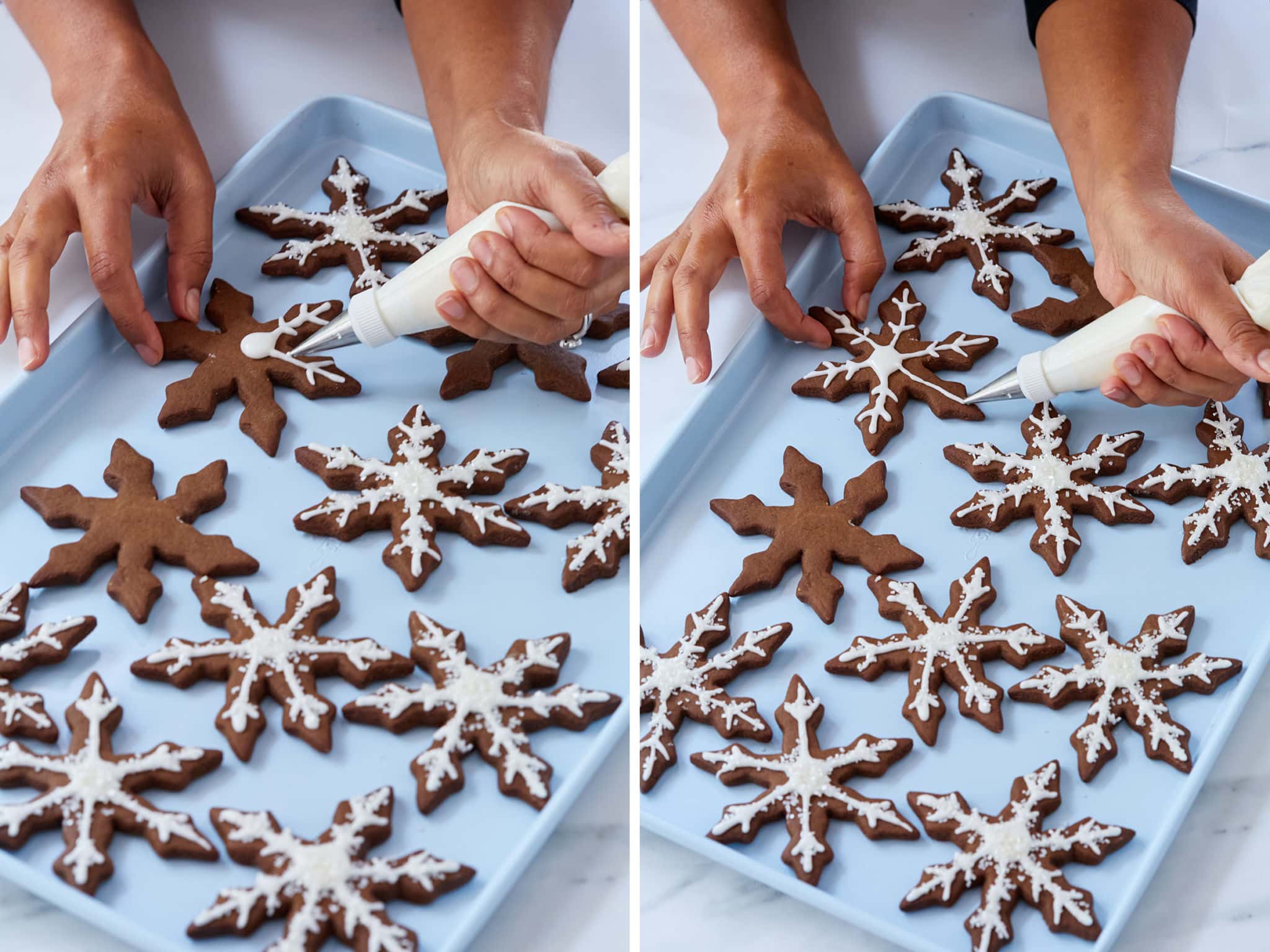 Hands decorating snow flake cookies.