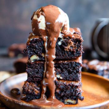 Dirty Chai Brownies stacked and topped with ice cream.