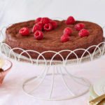 Flourless Chocolate Almond Torte topped with raspberries