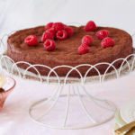 Flourless Chocolate Almond Torte topped with raspberries