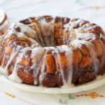 Cinnamon Roll Monkey Bread drizzled with cream cheese glaze.