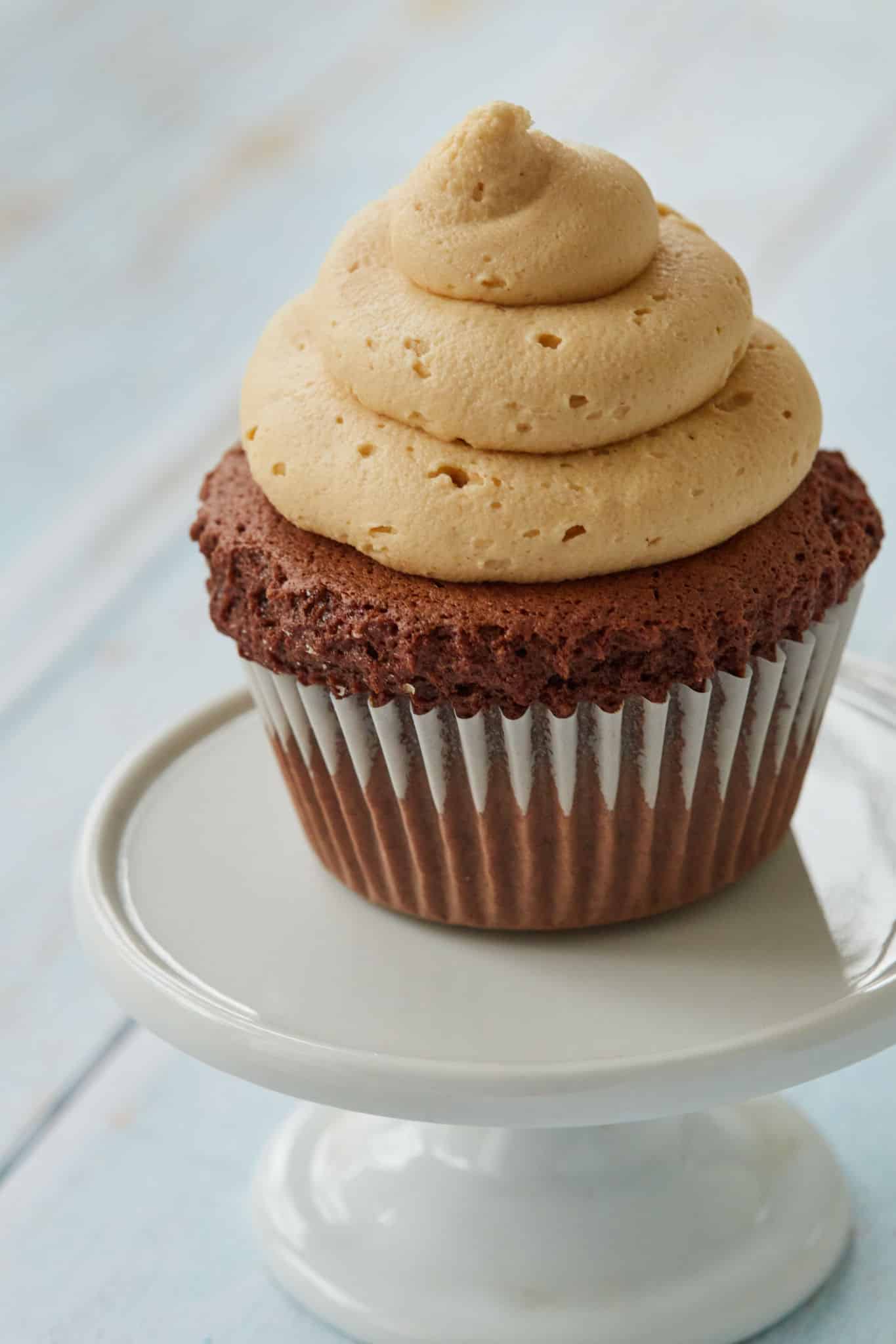 A cupcake topped with peanut butter frosting.