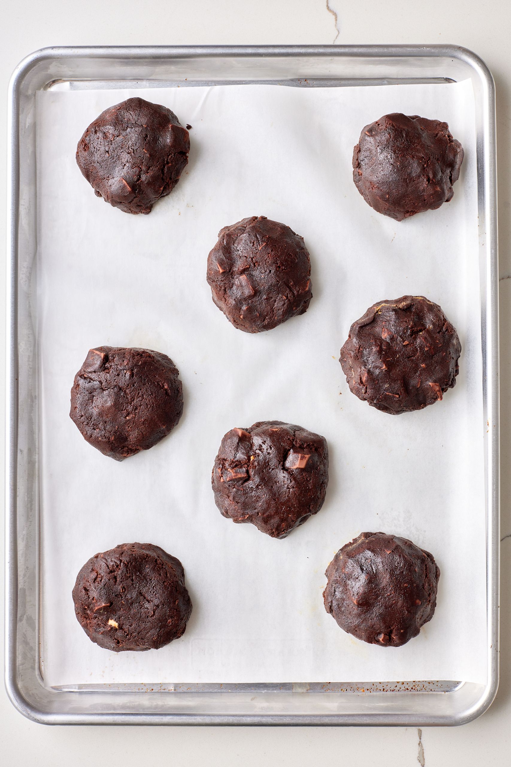 Triple Chocolate Chip Cookies13Triple Chocolate Chip Cookies11STEP8 scoop out 2 tablespoons of dough and roll into balls. Leave enough space between cookies for spreading during baking.