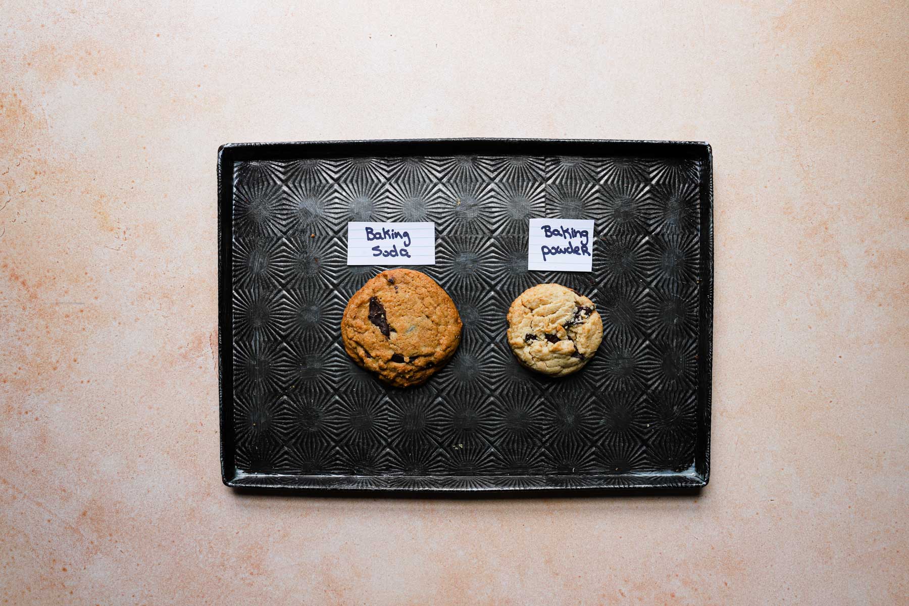 Two cookies on a tray.