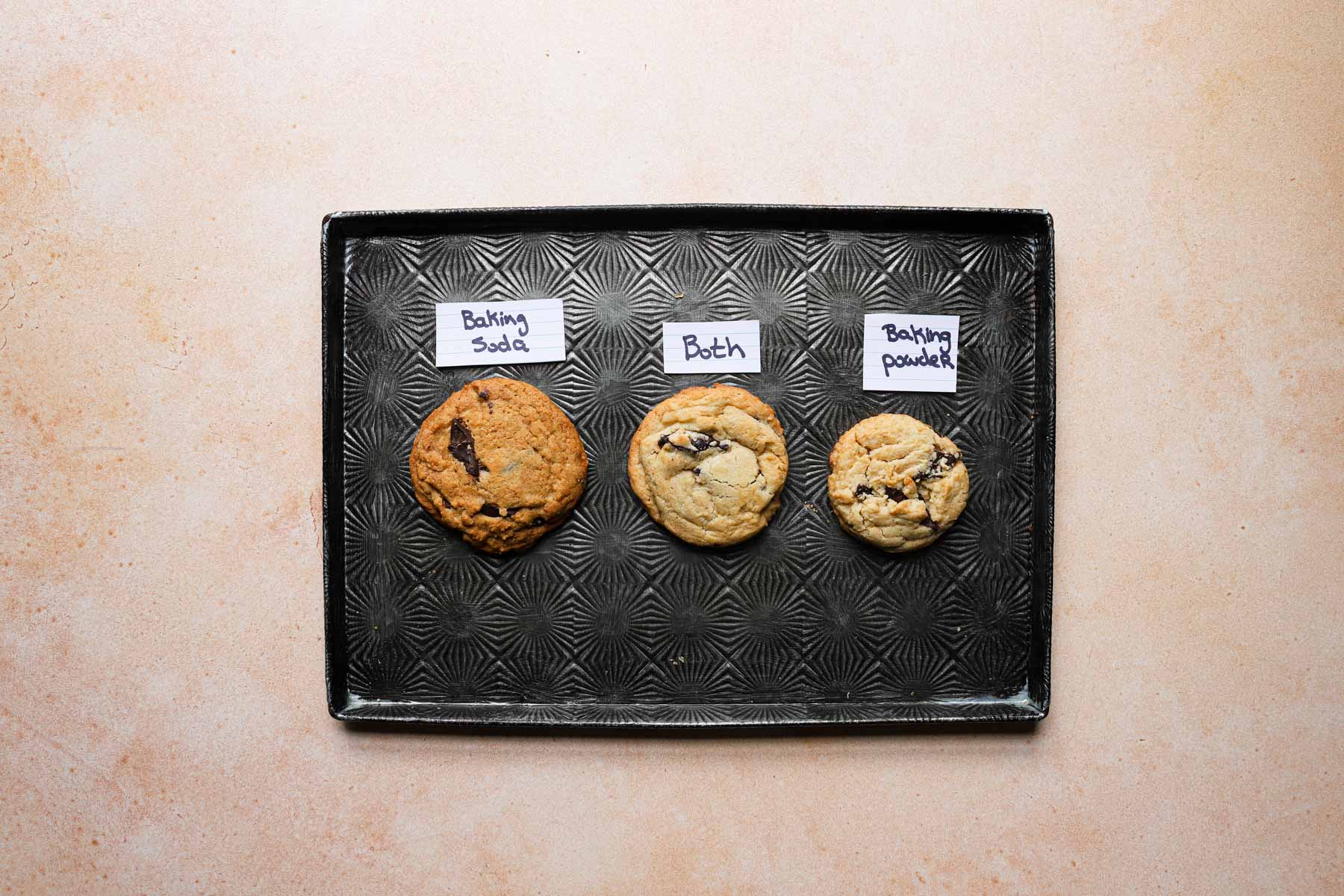 A tray with 3 cookies on it.