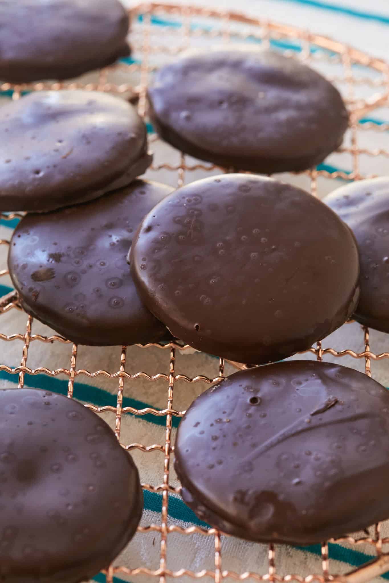 Thin mints resting on a cooling rack.
