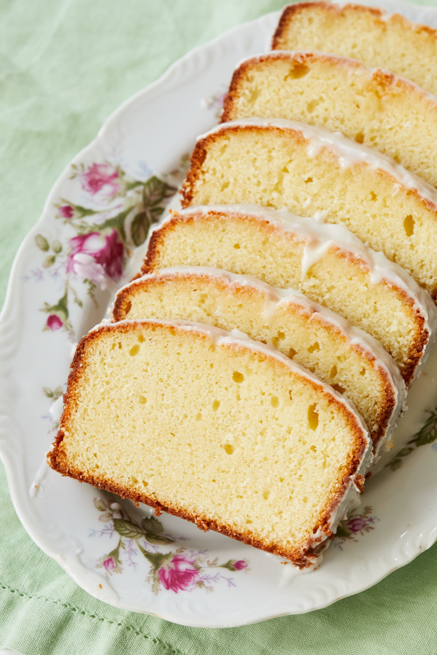 Lemon Yogurt Loaf Cake10 Slices show the moist crumb and smooth glaze.
