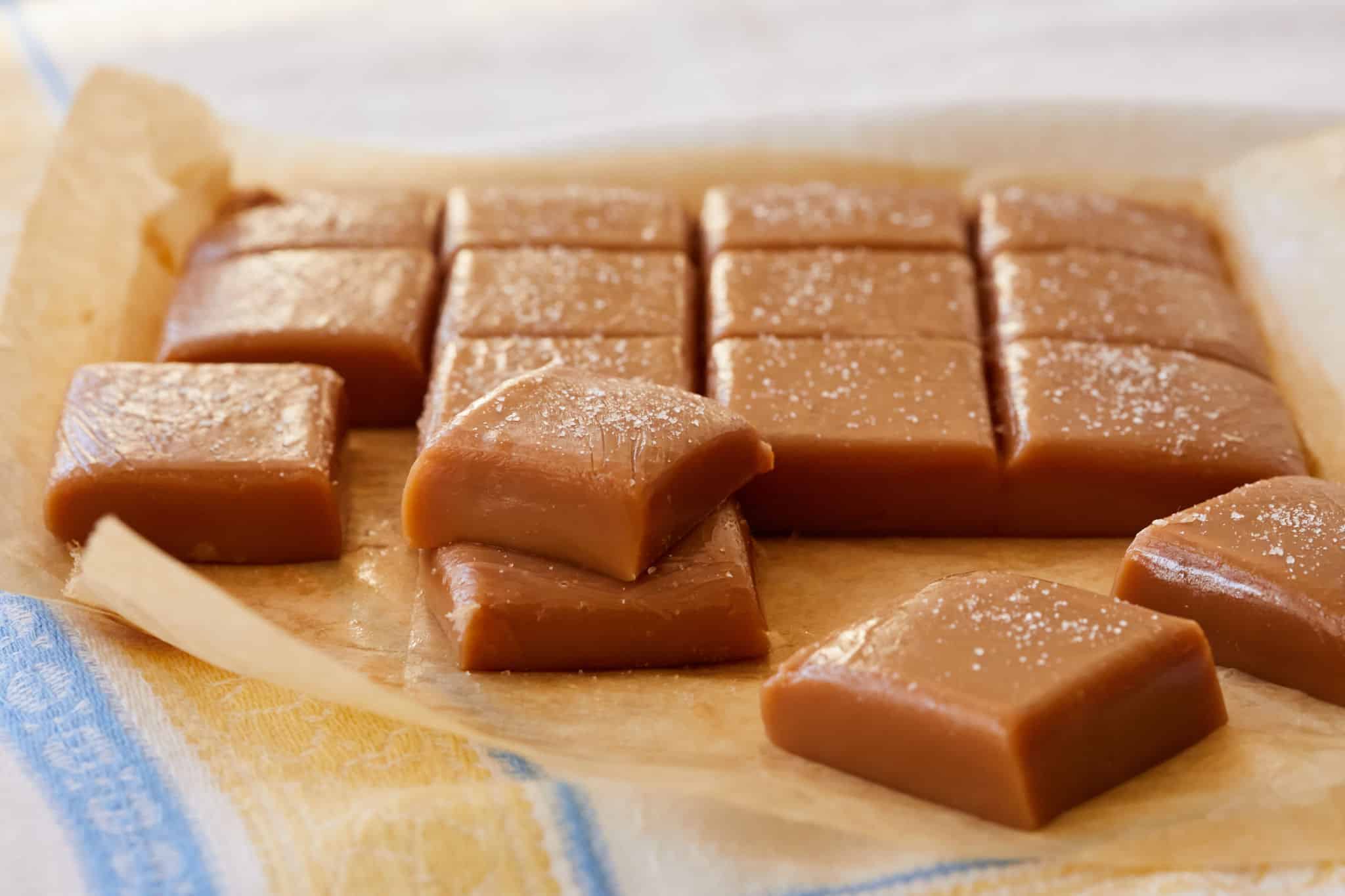 Squares of salted caramel candies.