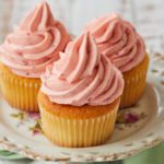 Strawberry Buttercream Frosting on top of cupcakes.