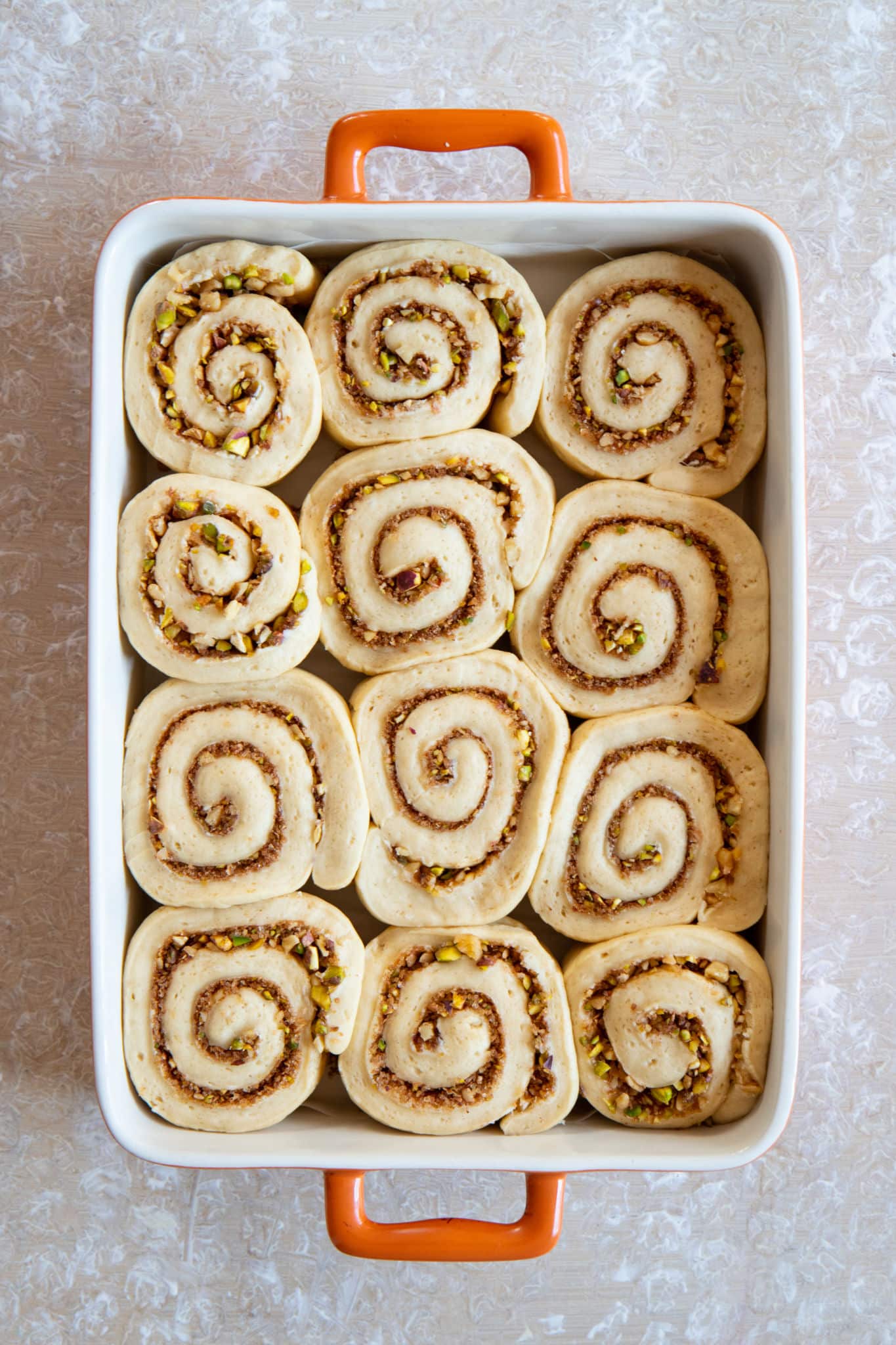 Top-down view of the cinnamon rolls before baking.
