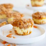 A carrot cake muffin on a plate.