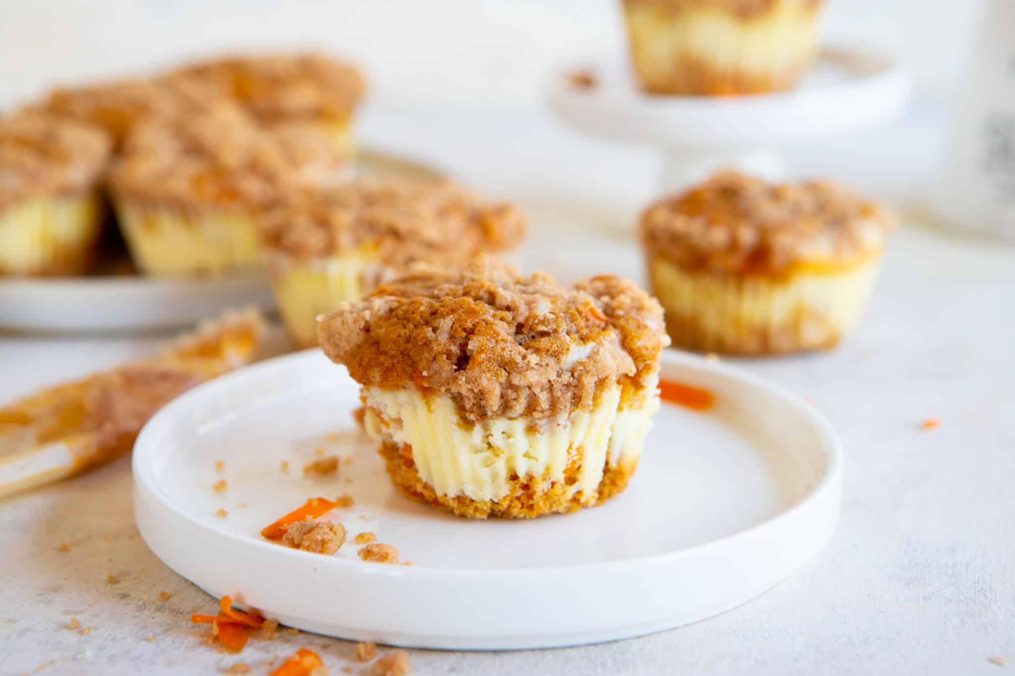 A carrot cake muffin on a plate.