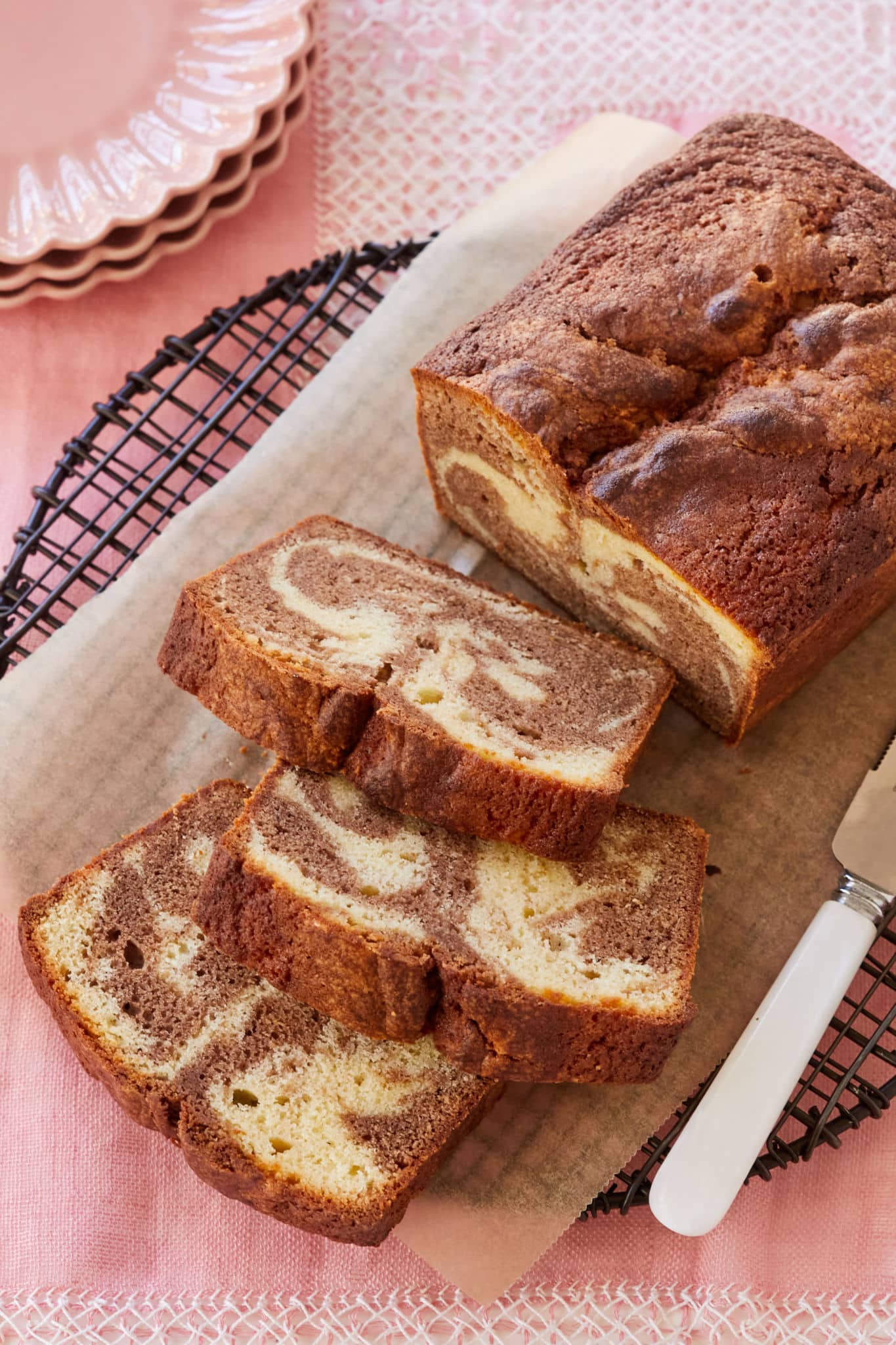 A loaf of marble pound cake sliced thick.