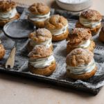 Cream Puffs sitting on a baking tray.
