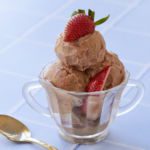 Ice cream for breakfast topped with strawberries