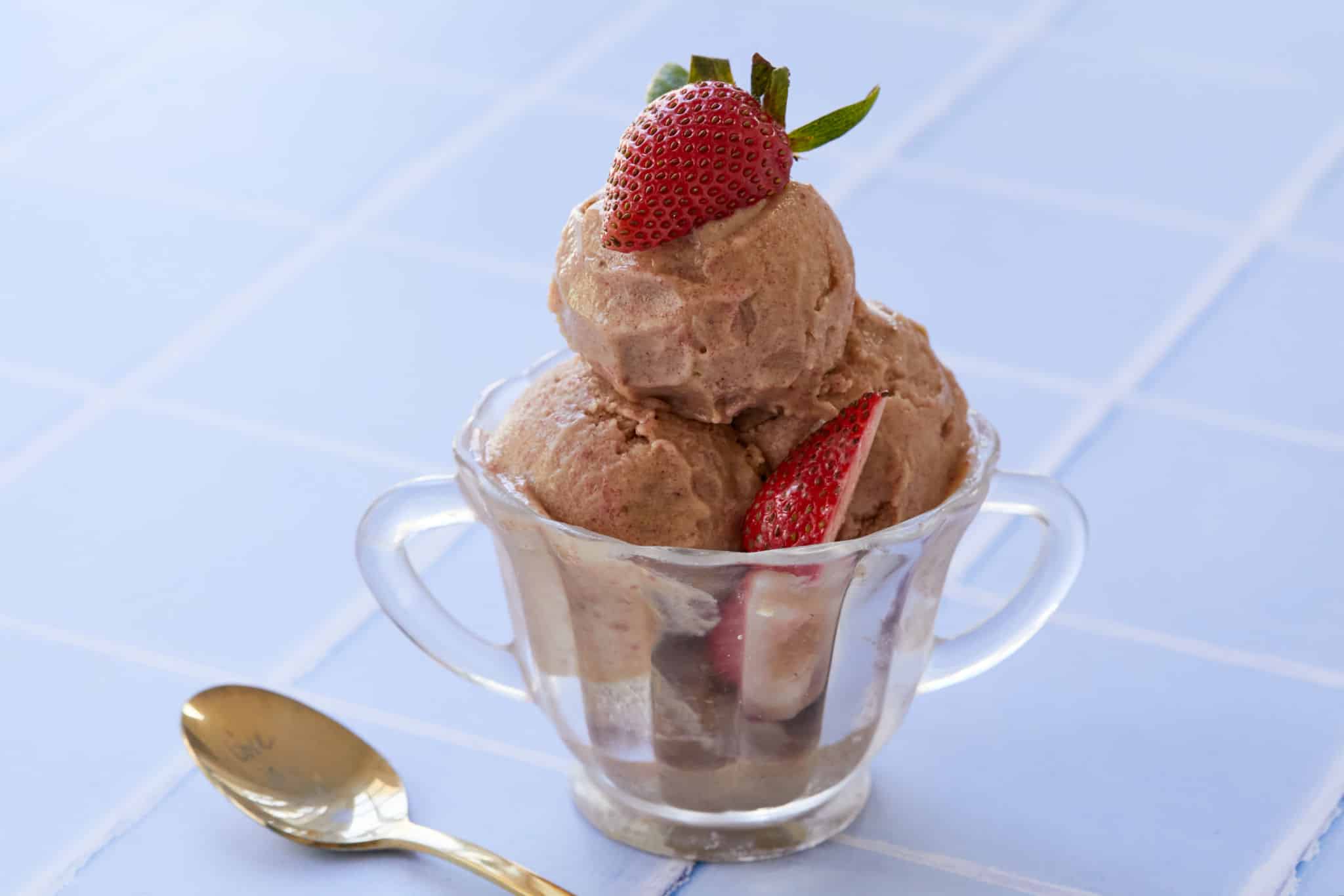 Ice cream for breakfast topped with strawberries