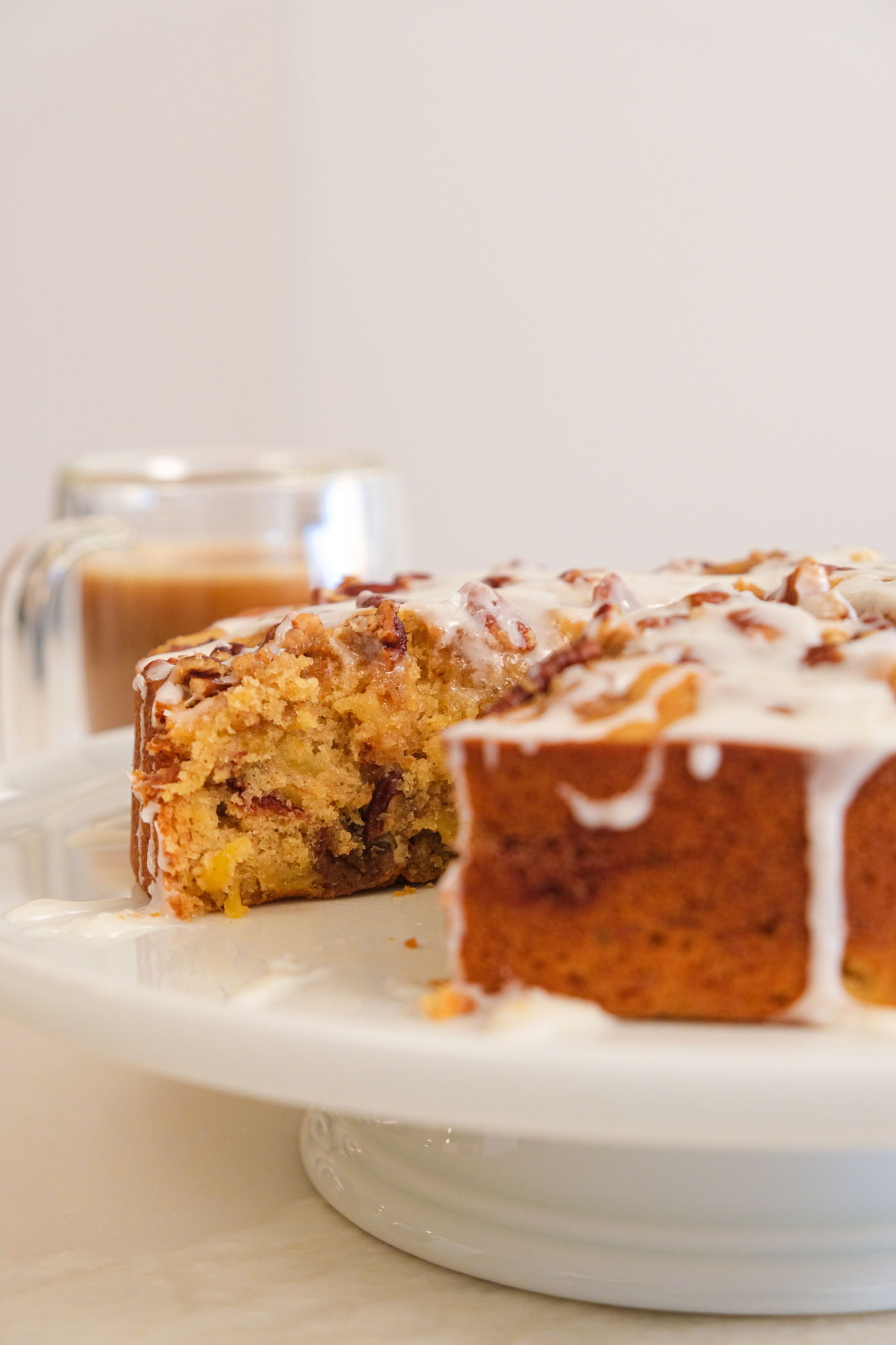 A hummingbird coffee cake with a slice removed