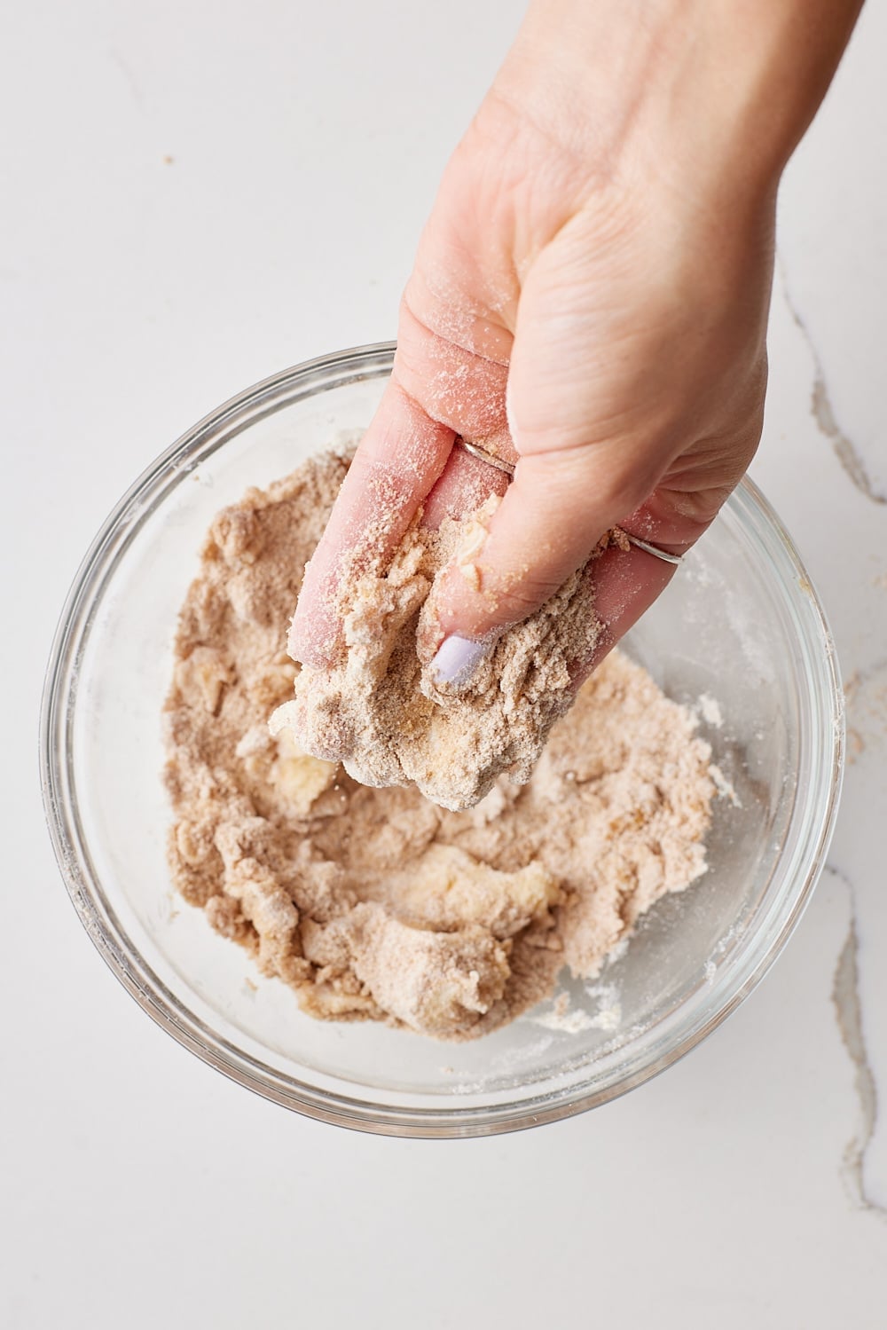 Rub butter in the dry ingredients of streusel topping until crumbly. 