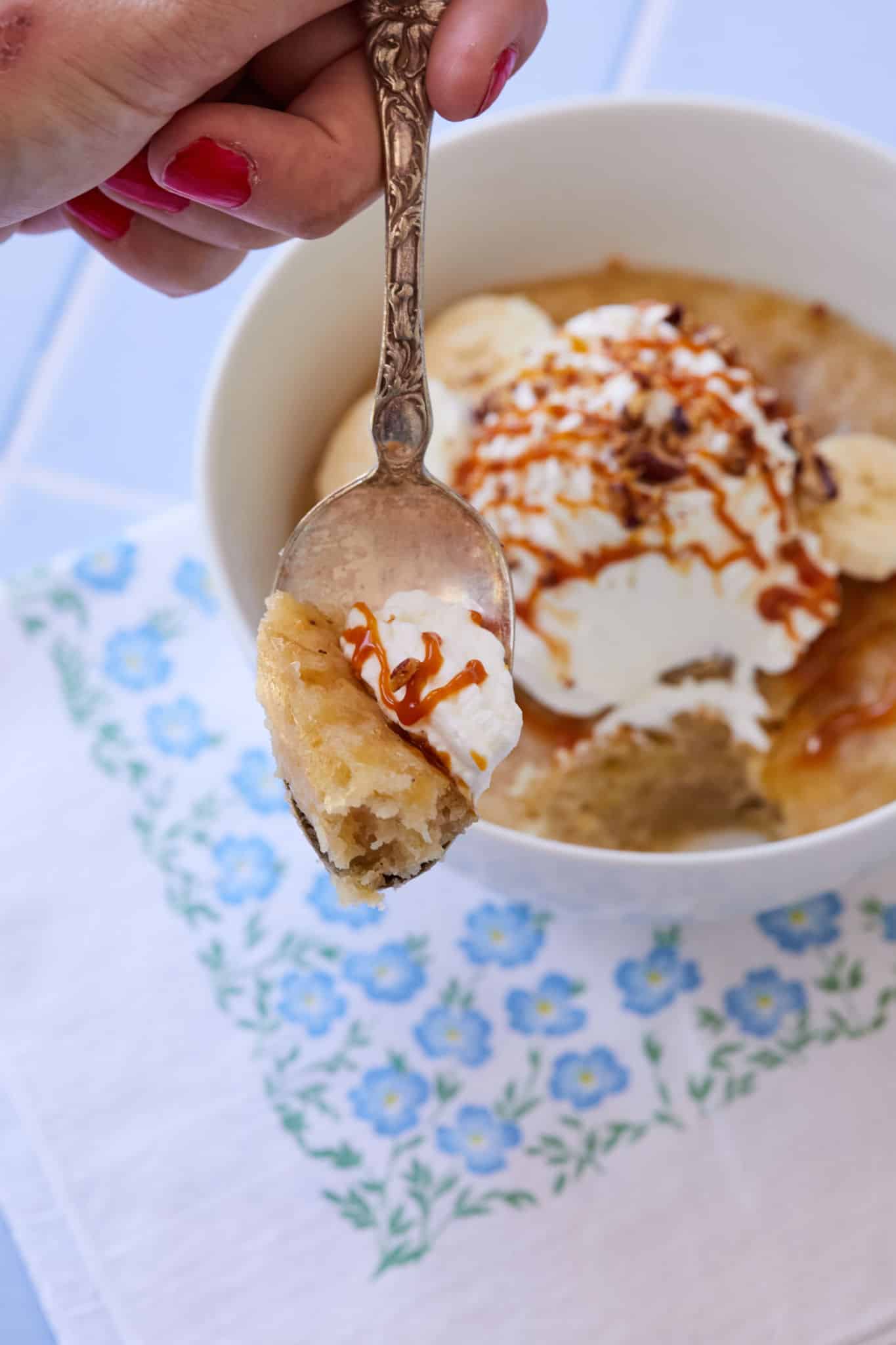A spoonful of banana cake from a microwave cake bowl
