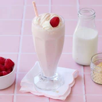 A raspberry malt next to the ingredients