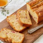 A cutting board with slices of Rhubarb and Ginger Quick Bread