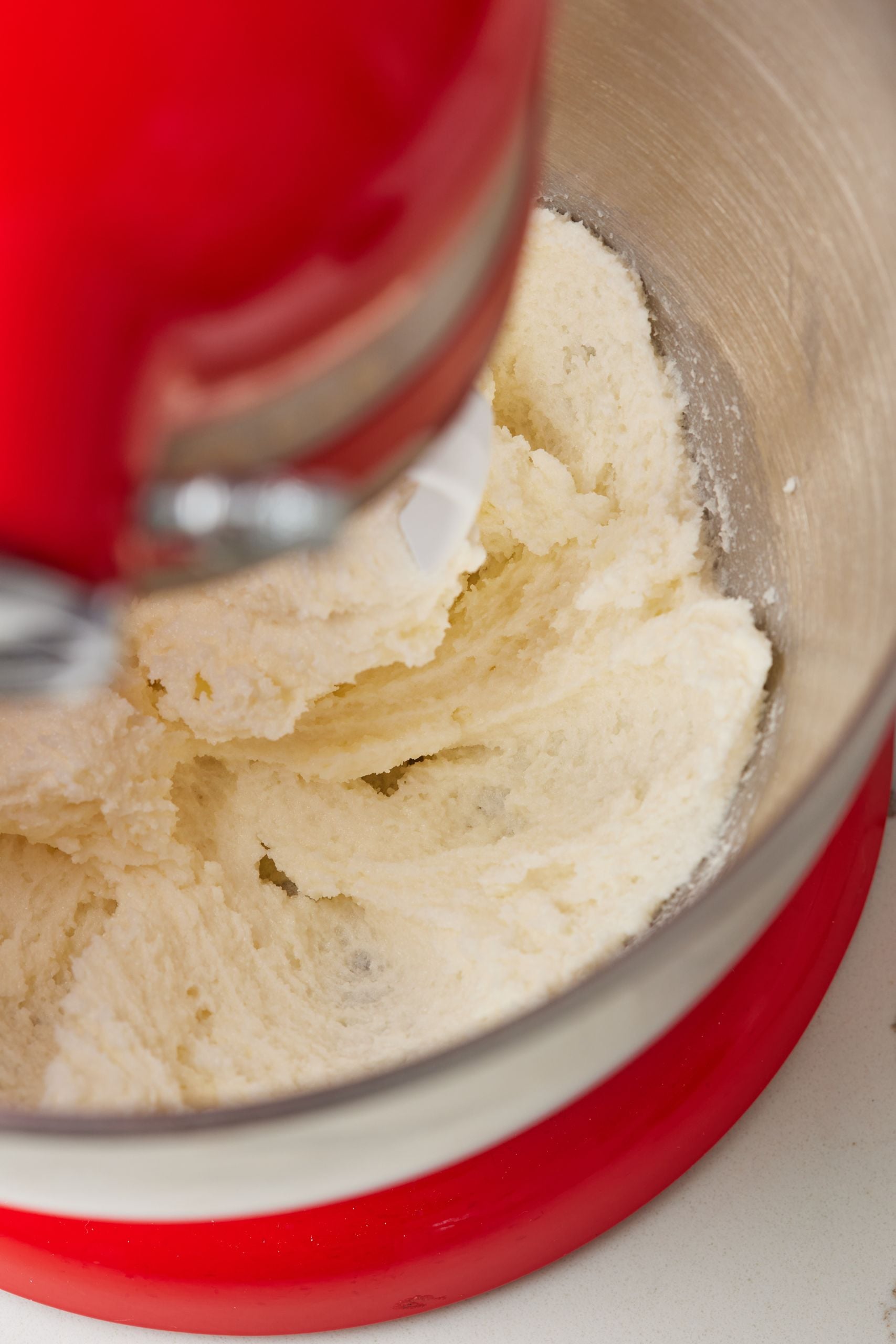 Step-by-step instructions on how to make Blueberry Buckle: cream butter and sugar until light and fluffy. 