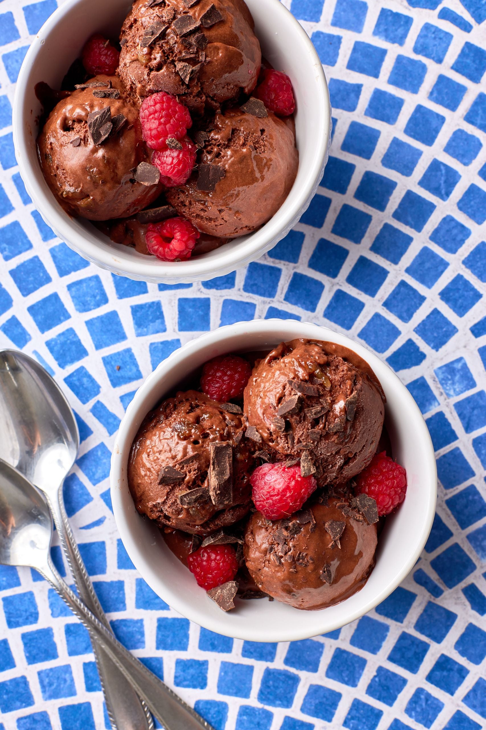 Healthy banana chocolate ice Crean is served with raspberries and chocolate chunks. 