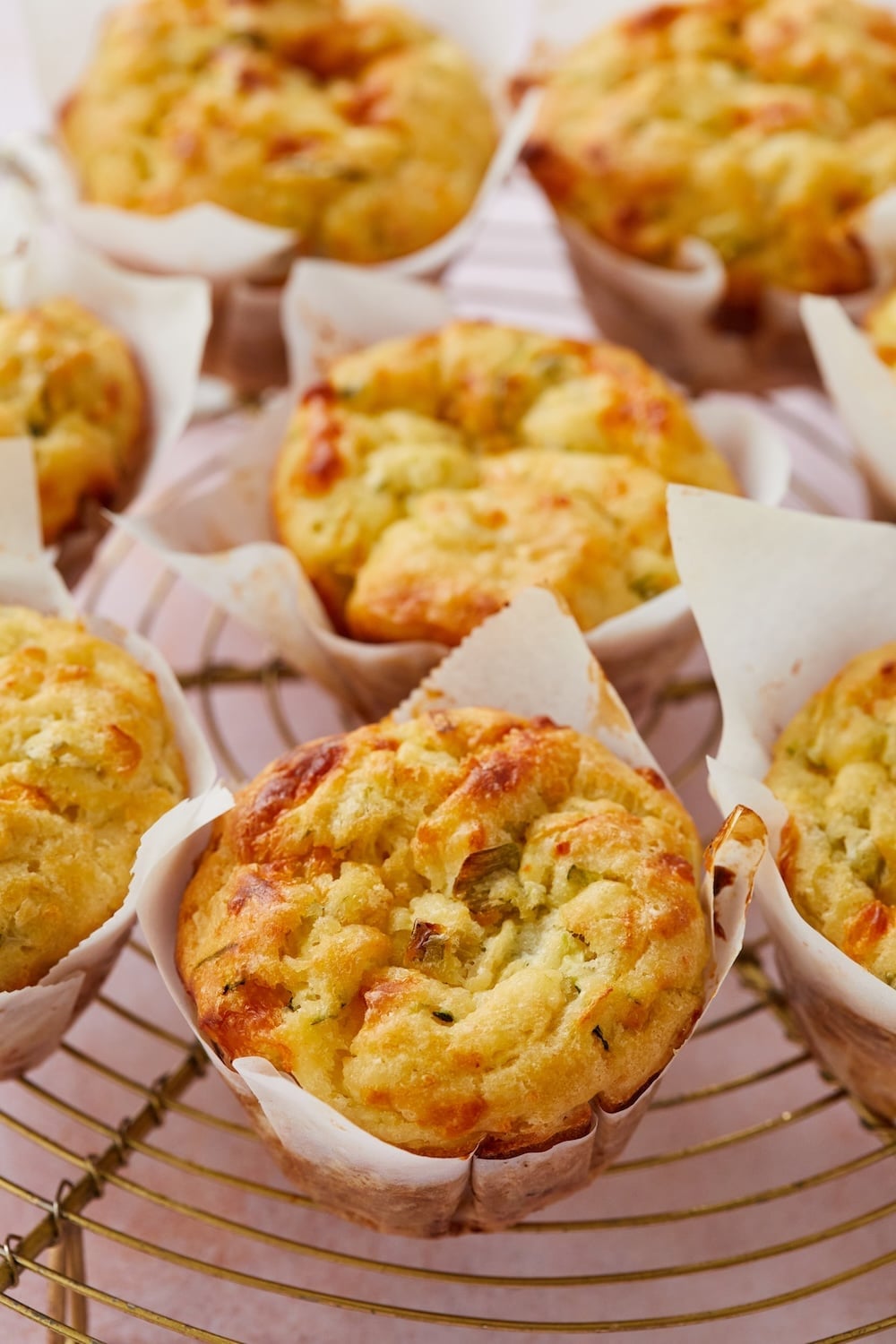 Zucchini & Cheese Muffins2 zucchini cheese muffins on wire rack
