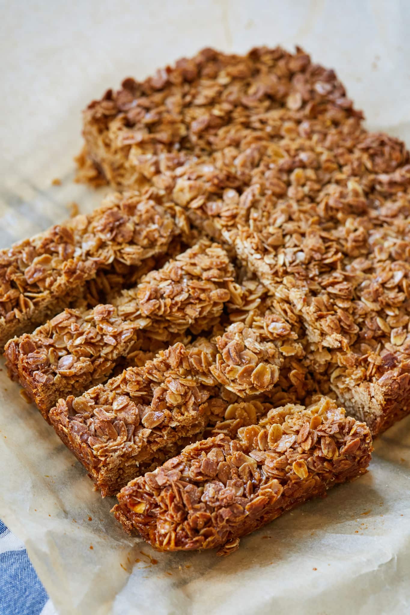 Homemade Irish Oat Flapjacks are sliced into individual bars. The oats are a golden brown.