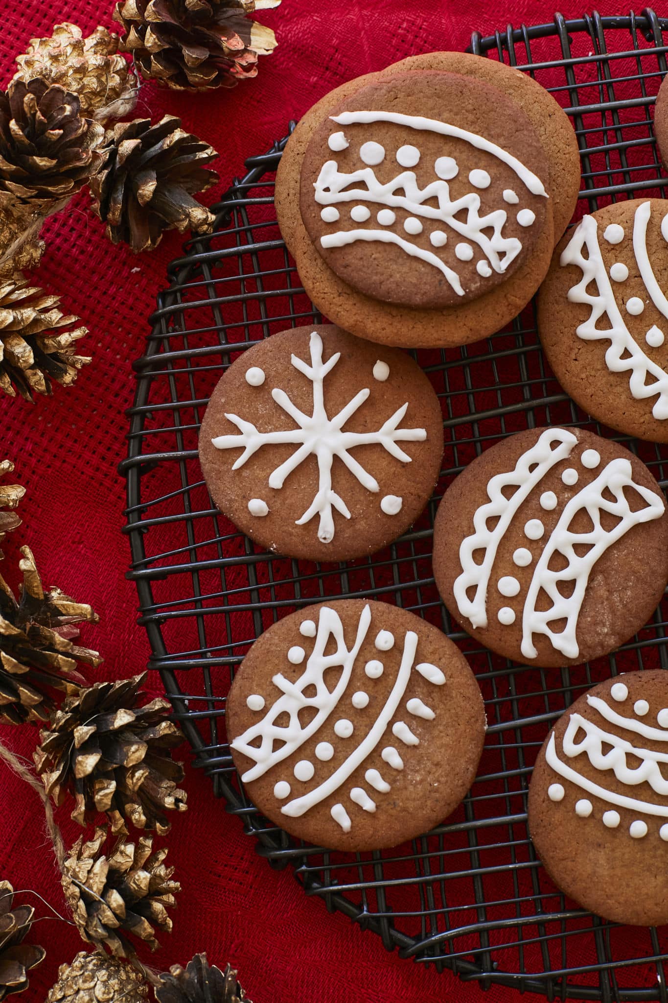 Snappy, crispy Pepparkakors are decorated with homemade royal icing for the holidays.