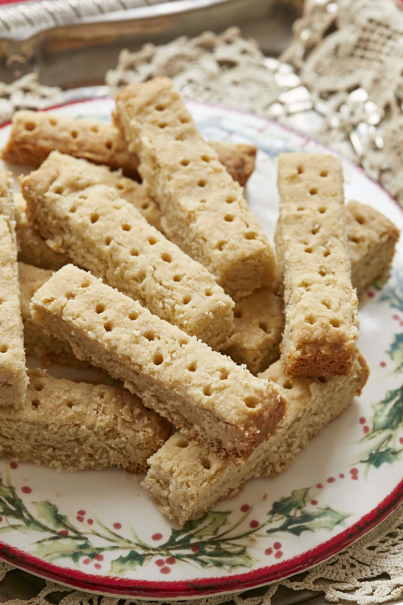 A close-up image of the homemade Scottish Shortbread Cookies show a flakey texture and the skewer marks poked throughout to allow steam to escape while baking. 