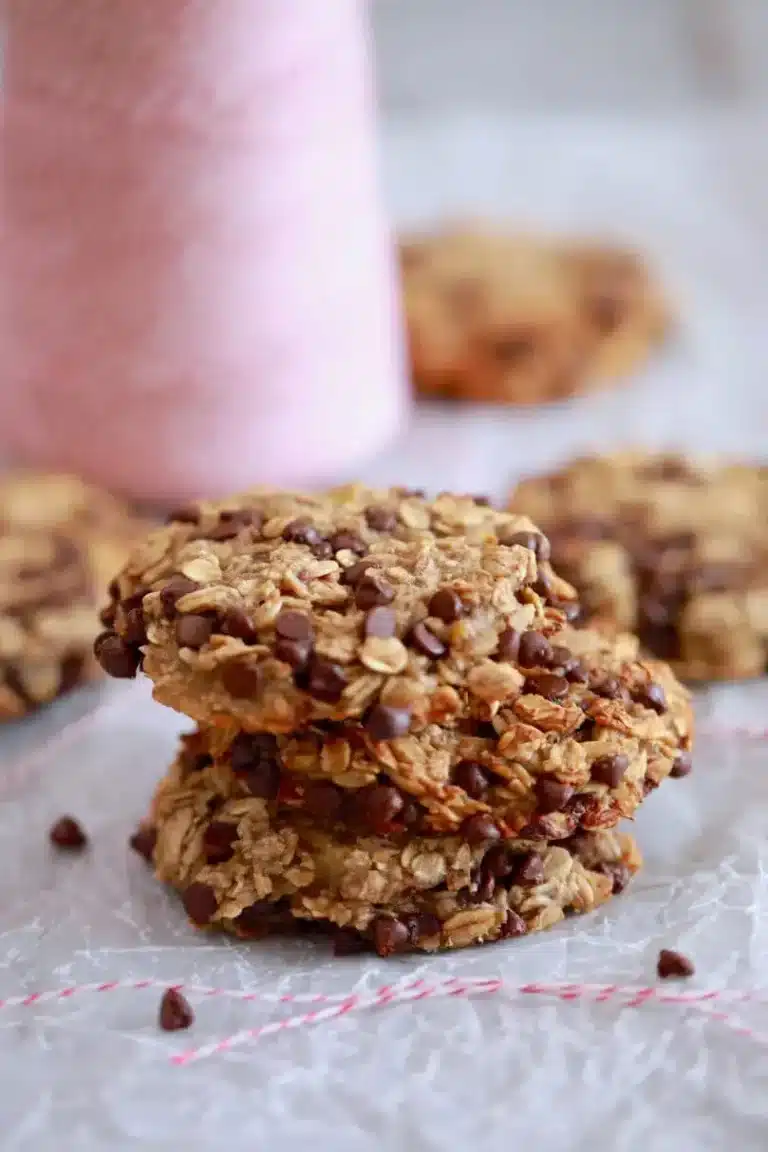 Three chocolate oatmeal cookies are stacked on top of each other. 