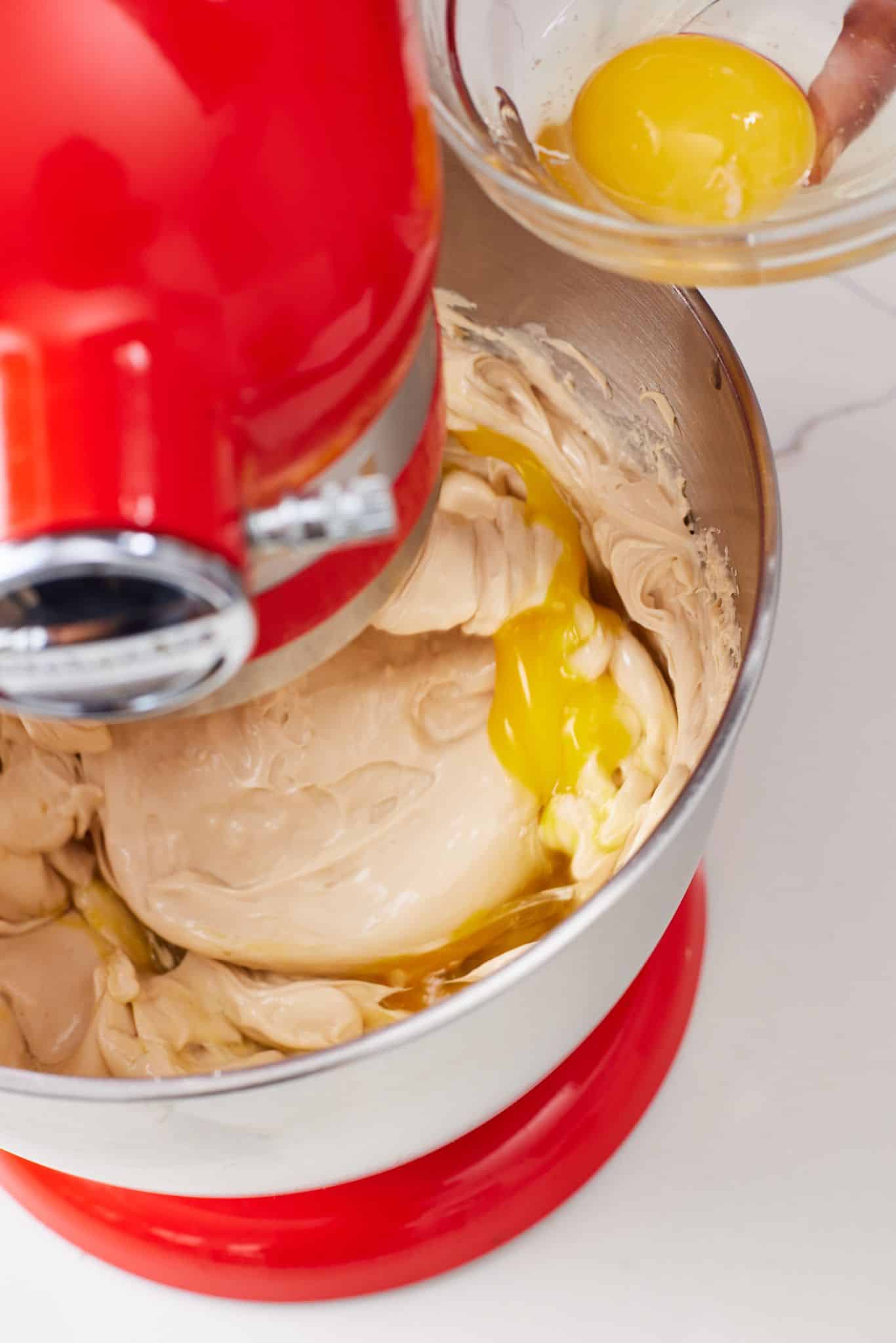 Caramel Apple Cheesecake5 Beat in the eggs one at a time, scraping down the sides of the bowl after each addition.