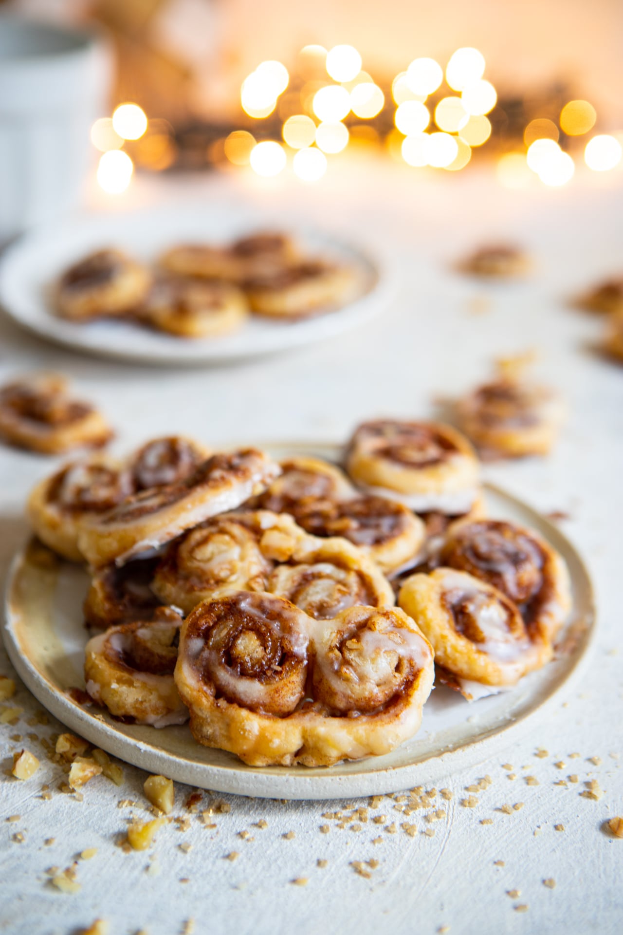 A plat of cinnamon roll palmiers on a ceramic plate. 