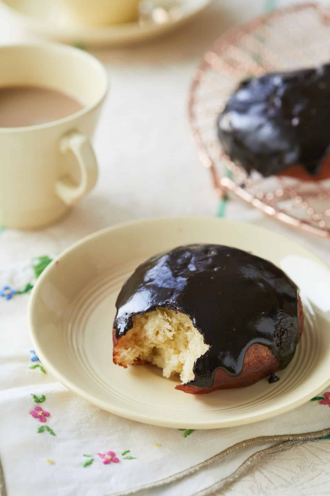Boston Cream Donuts Recipe showing donut center with tea by side