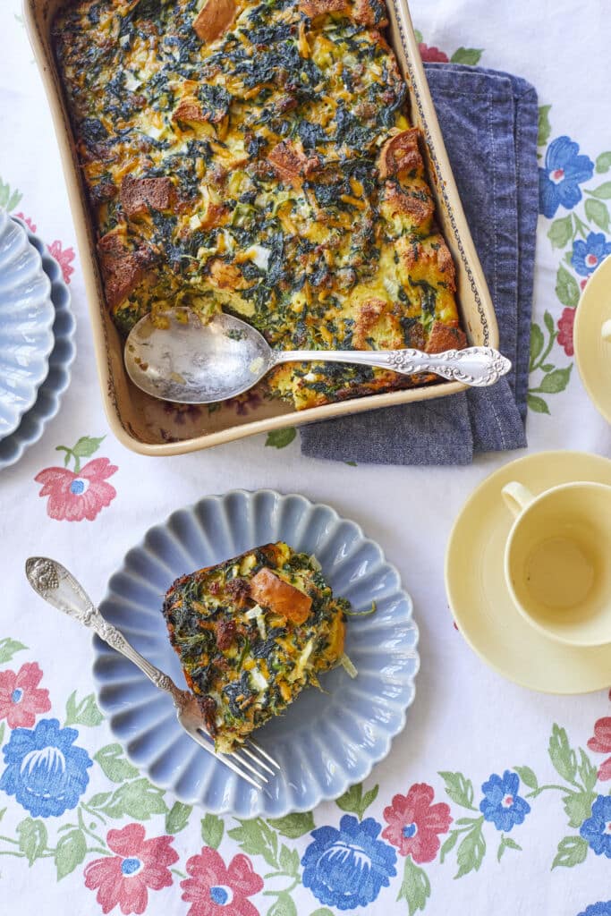 Make-Ahead Breakfast casserole is golden brown and crispy on top. It's loaded with spinach, bread, and custard.
