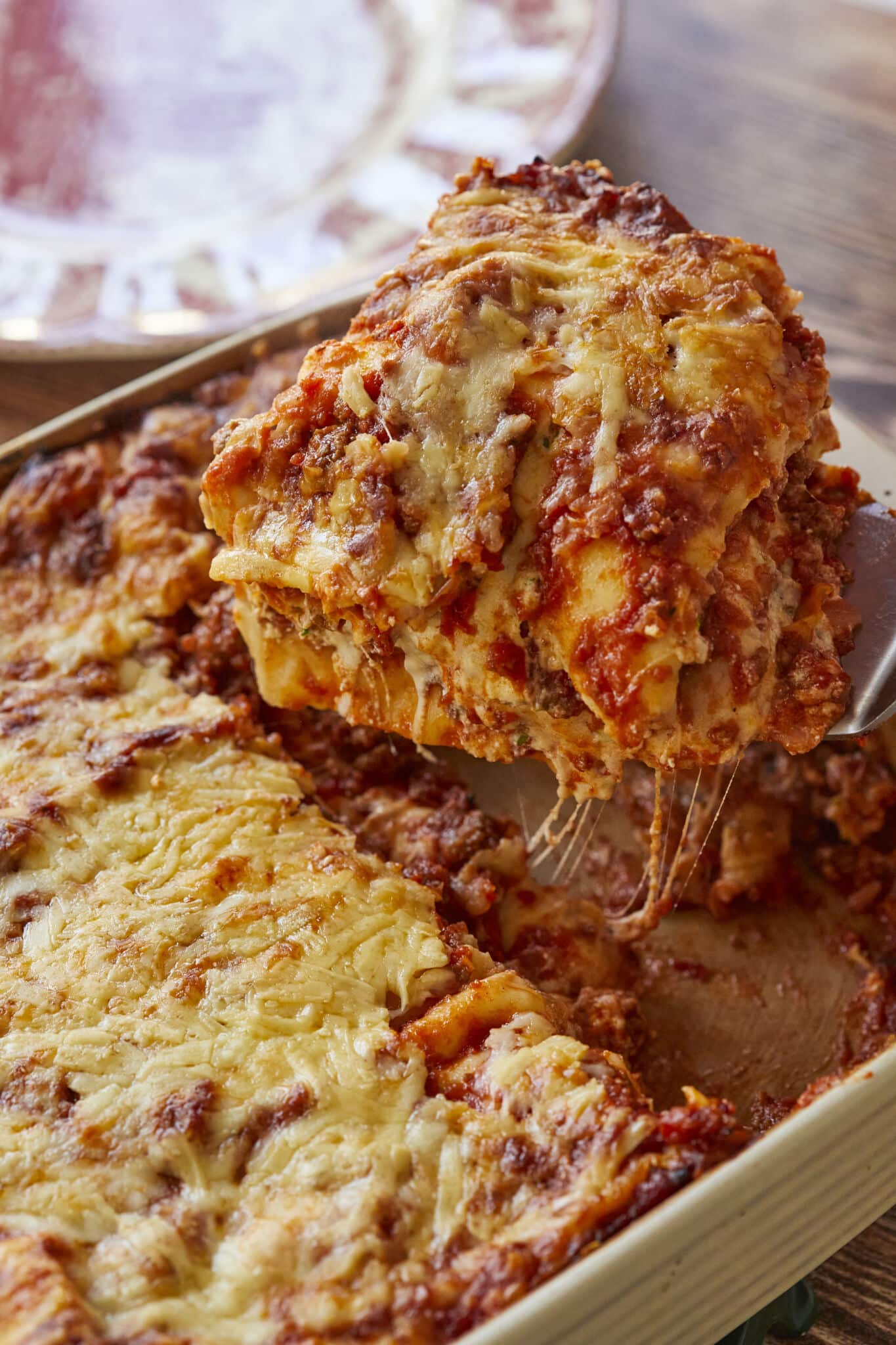 The Best Lasagna Recipe (100% From Scratch!) close shot of a corner scoop baked Lasagna 