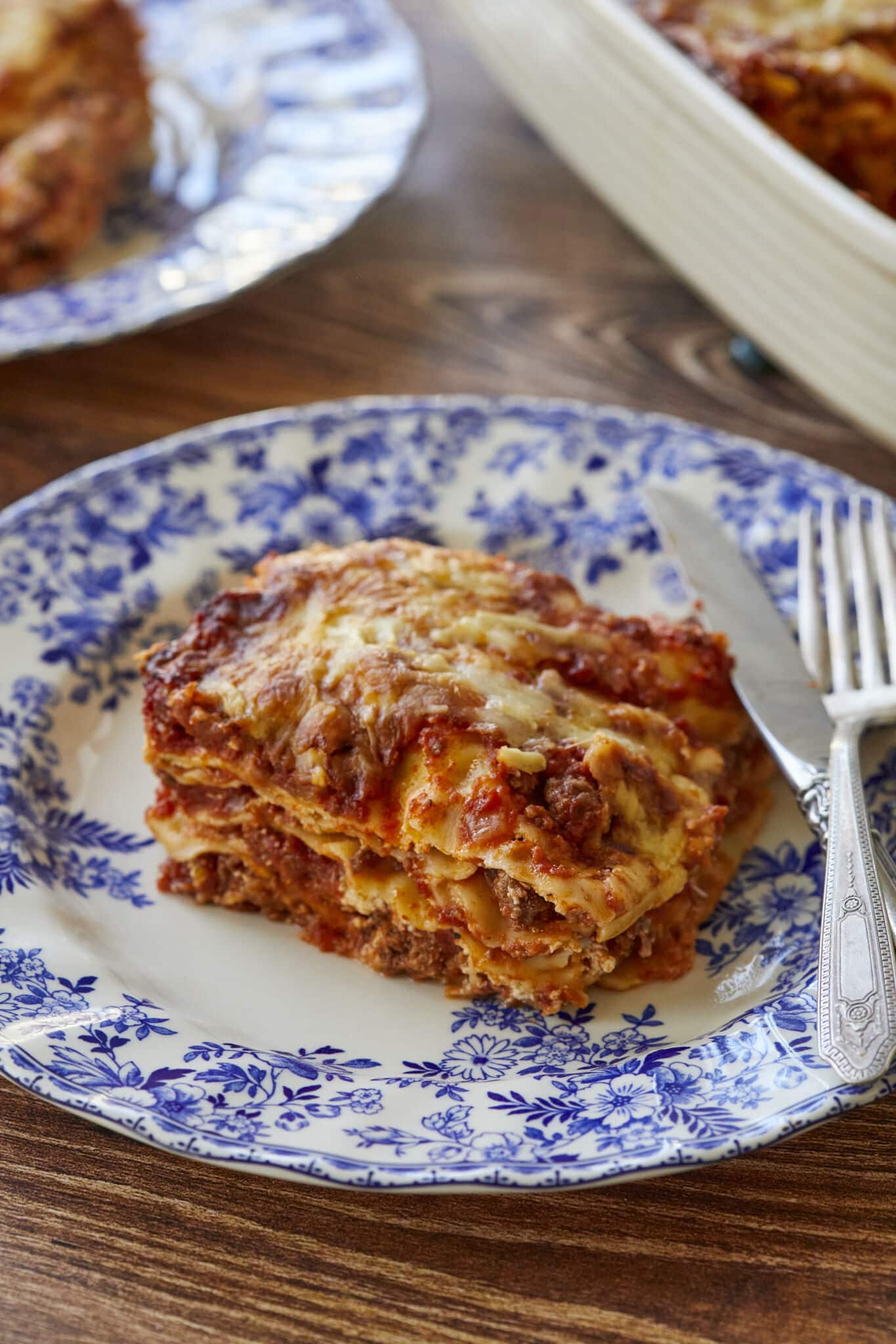The Best Lasagna Recipe (100% From Scratch!) single serving ready with fork knife 