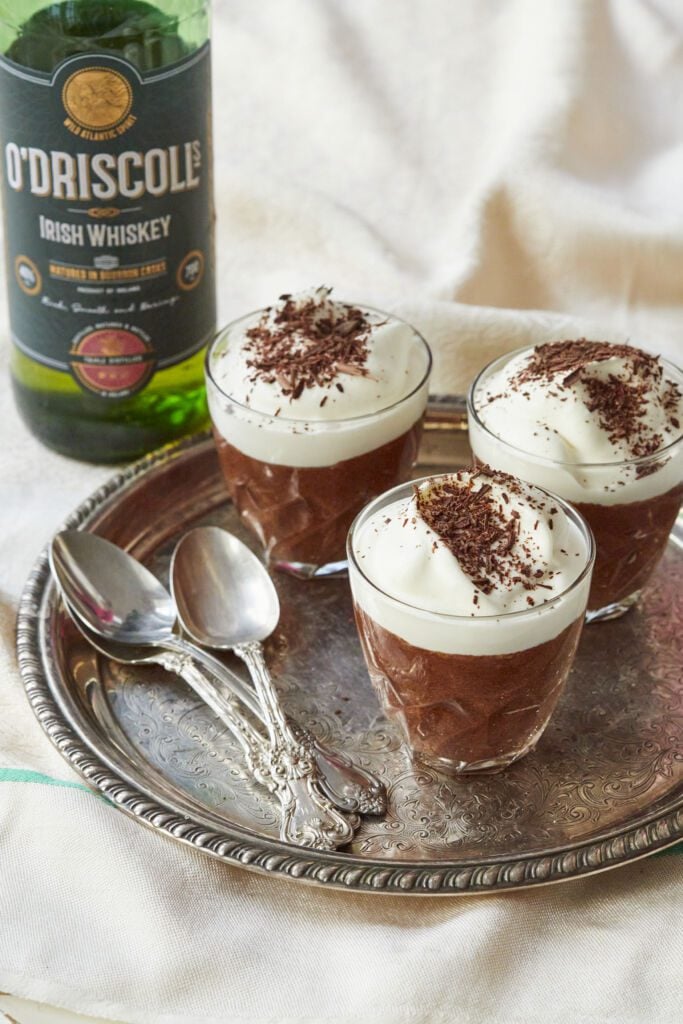 Silky Irish Whiskey Chocolate Mousse is topped with whipped cream and chocolate shaving.