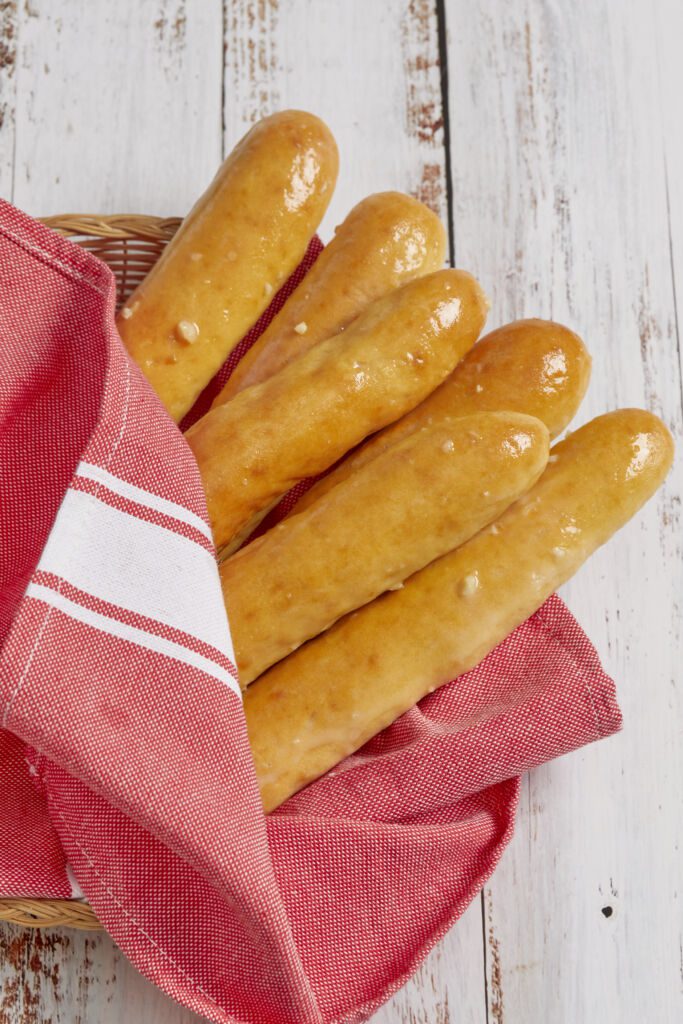 3-Ingredient Bread Sticks (no yeast) are baked golden brown and displayed in a basket.